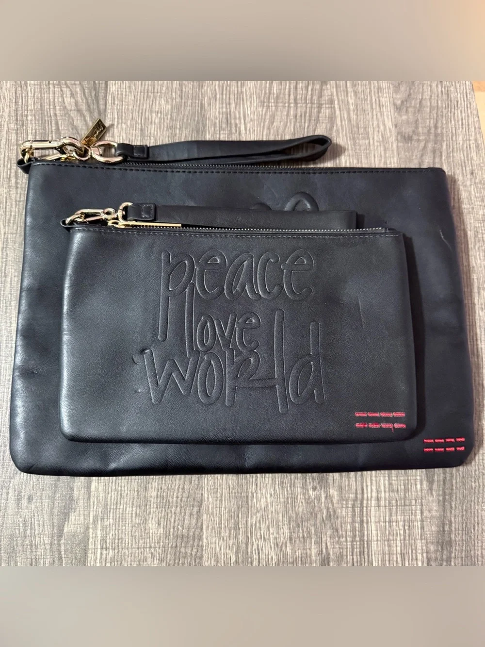 2 Peace Love World Black Embossed Leather Clutch Wristlets